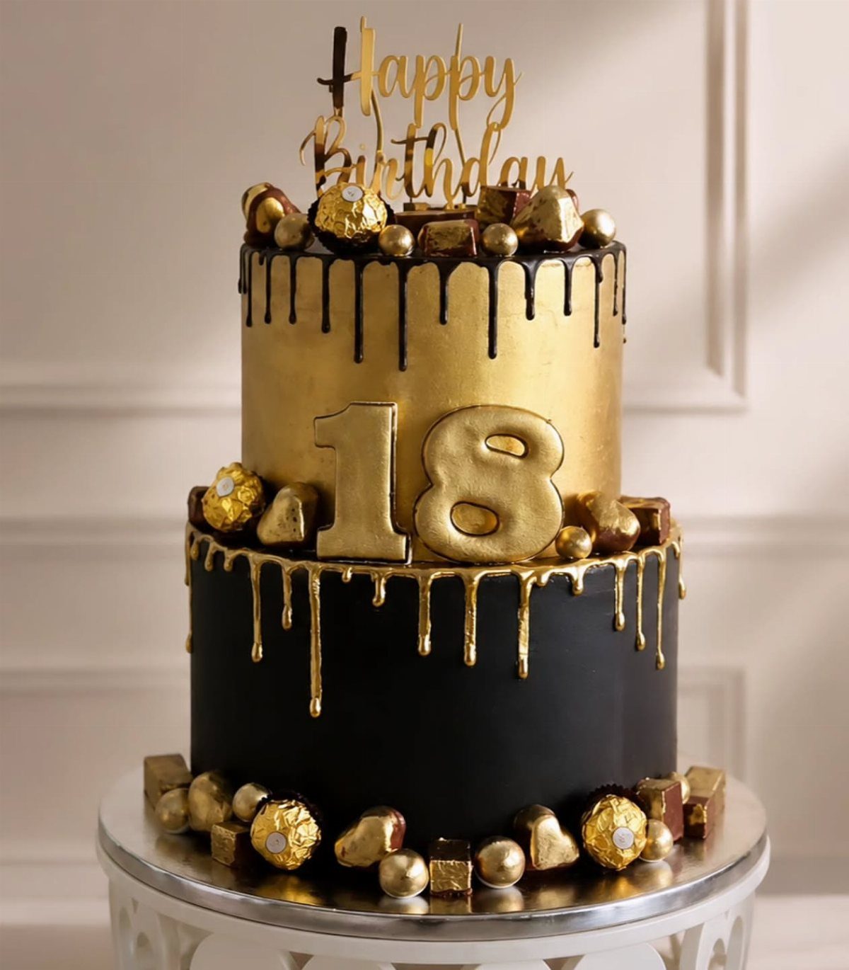 Two-tier black and gold birthday cake with gold drips and number 18 topper.