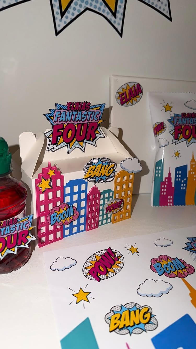 Superhero party treat box and labels with colorful city skyline and comic bubbles.