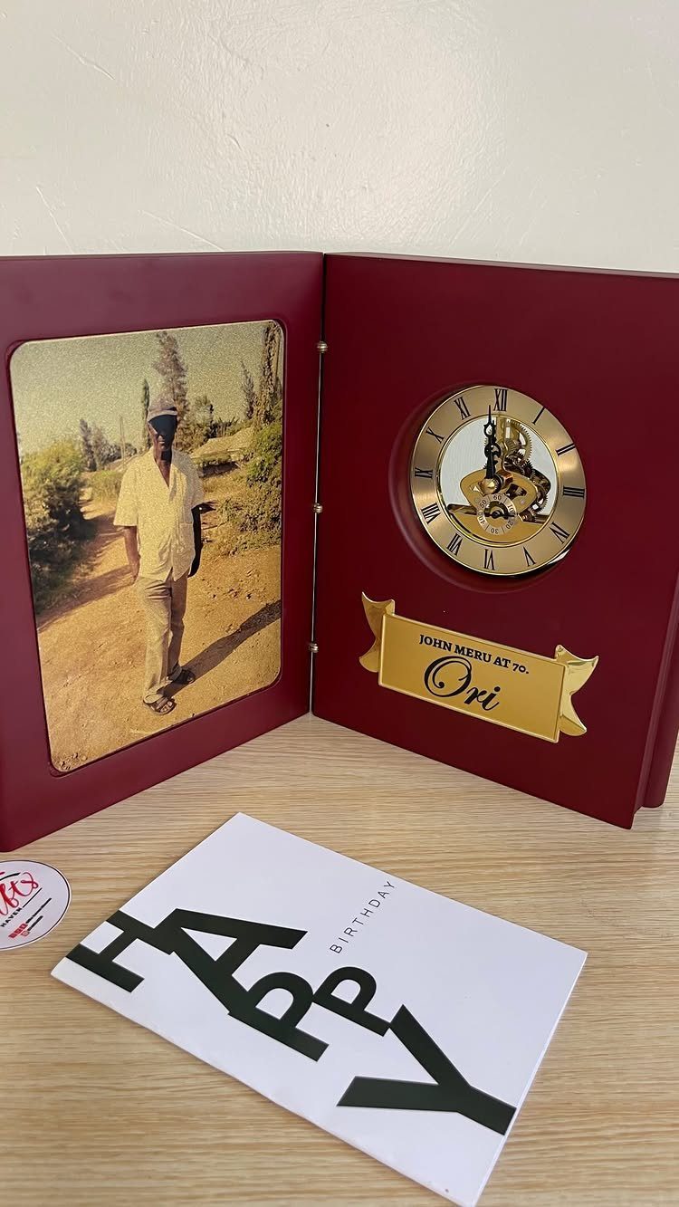 Personalized burgundy gift box with a photo, clock, and birthday card.