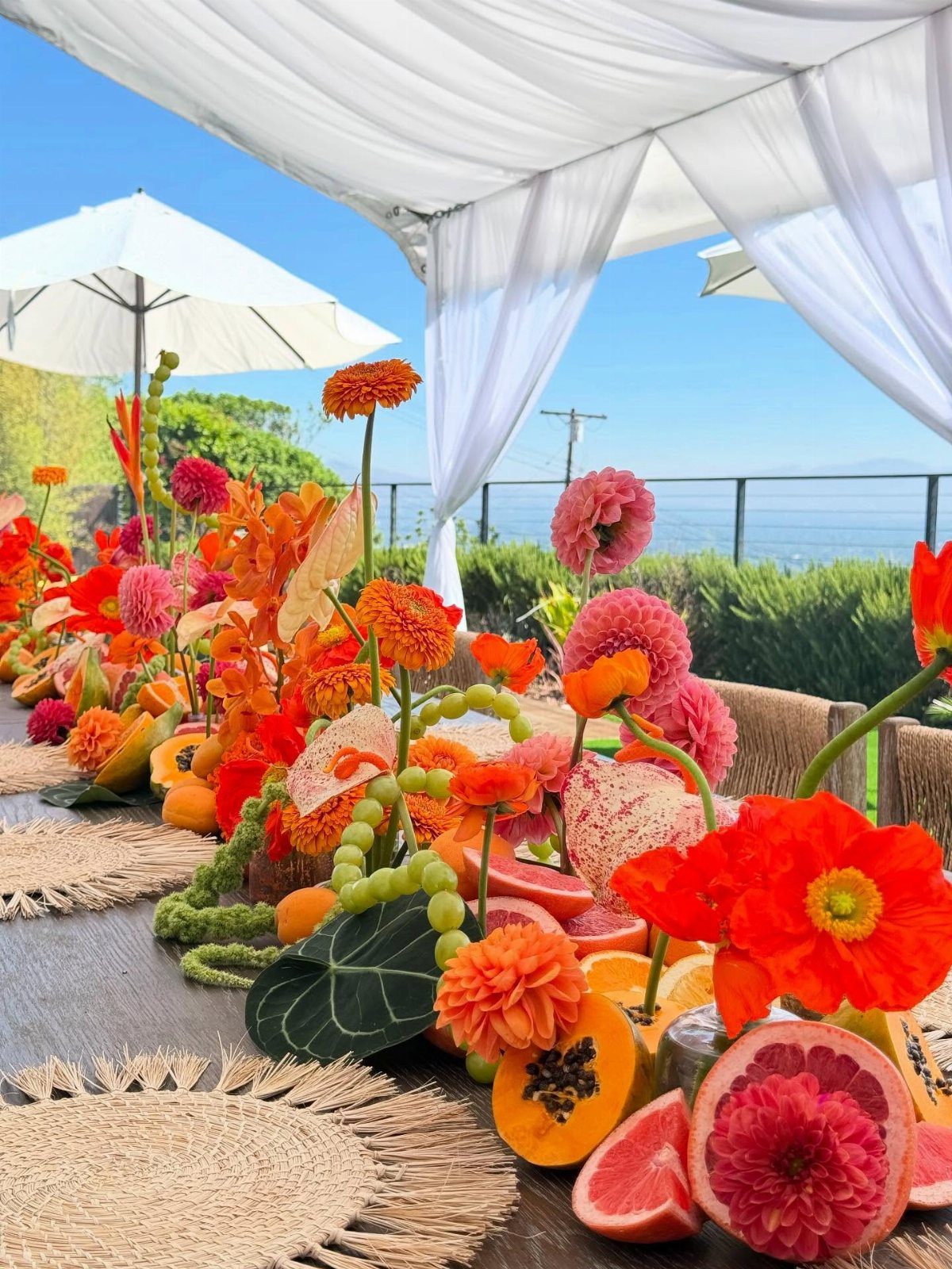 Fruit and floral garland runner with citrus and orange flowers on wooden table