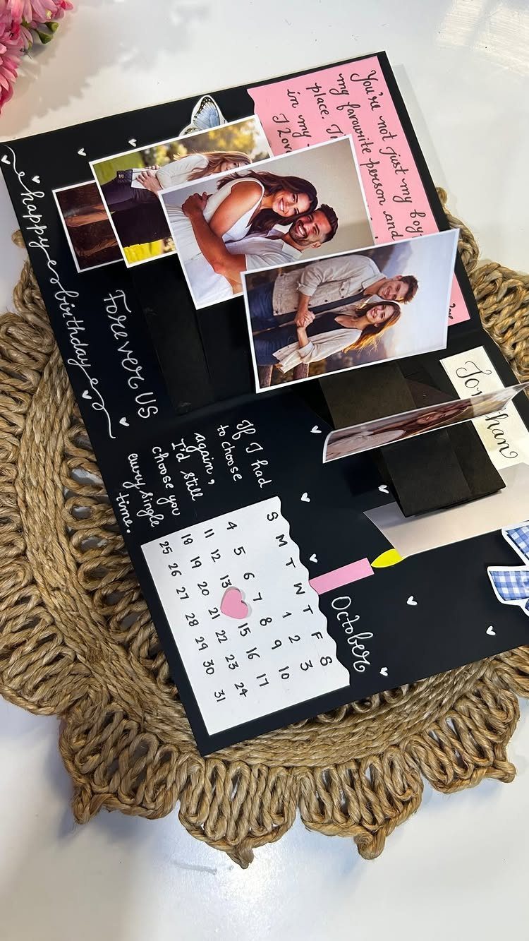 Handmade black accordion birthday card with photos of a couple and October calendar.