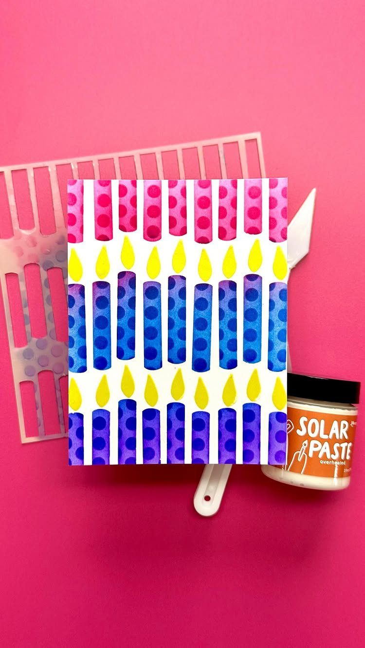 Handmade card with blue and purple polka dot candles on a pink background.
