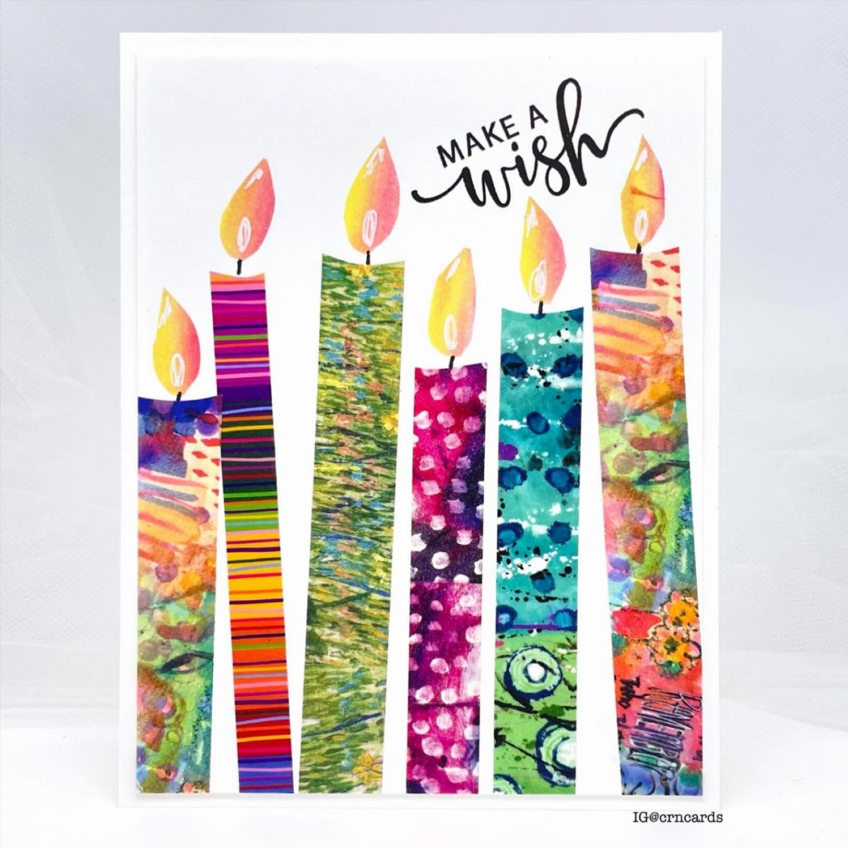Handmade birthday card with colorful paper strip candles and Make a Wish calligraphy.