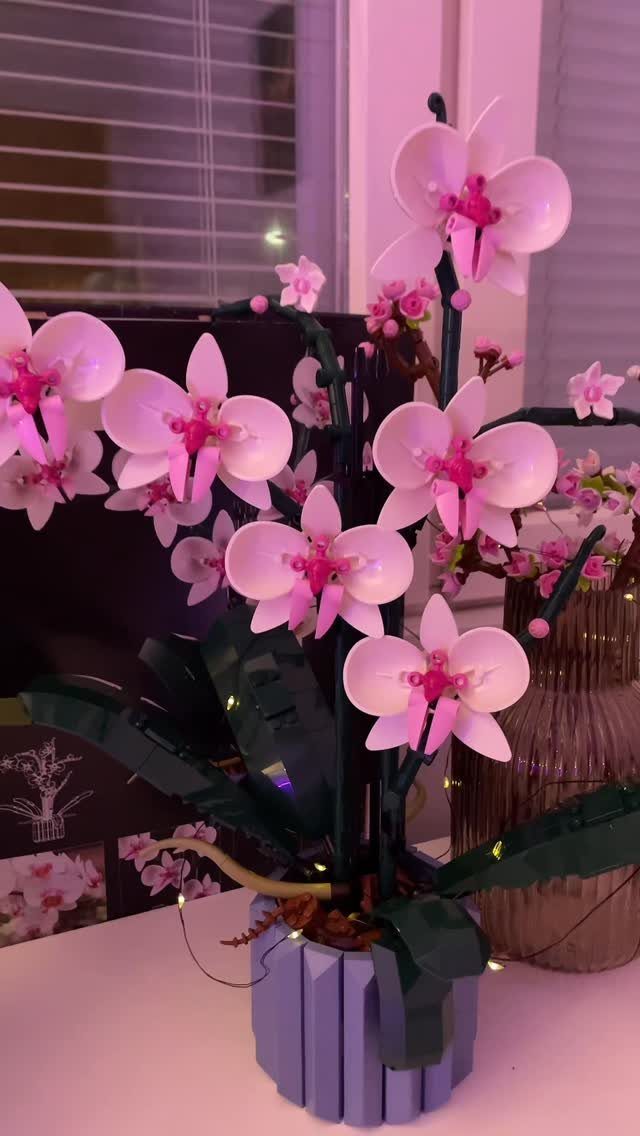 LEGO orchid with pink and white flowers in a light blue pot