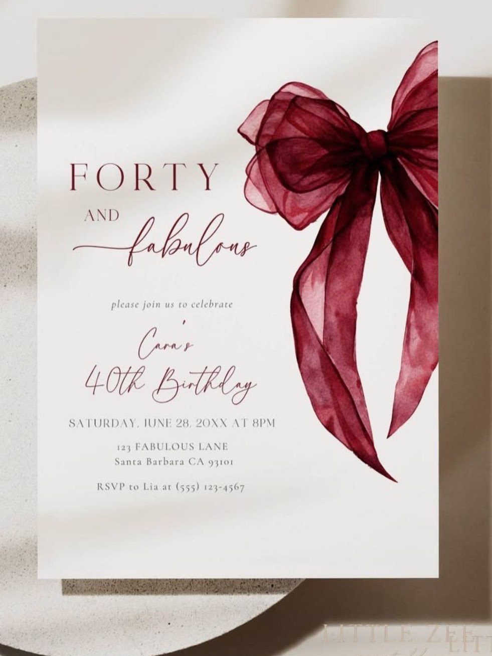 Birthday invitation card with a burgundy watercolor bow for a 40th birthday celebration.