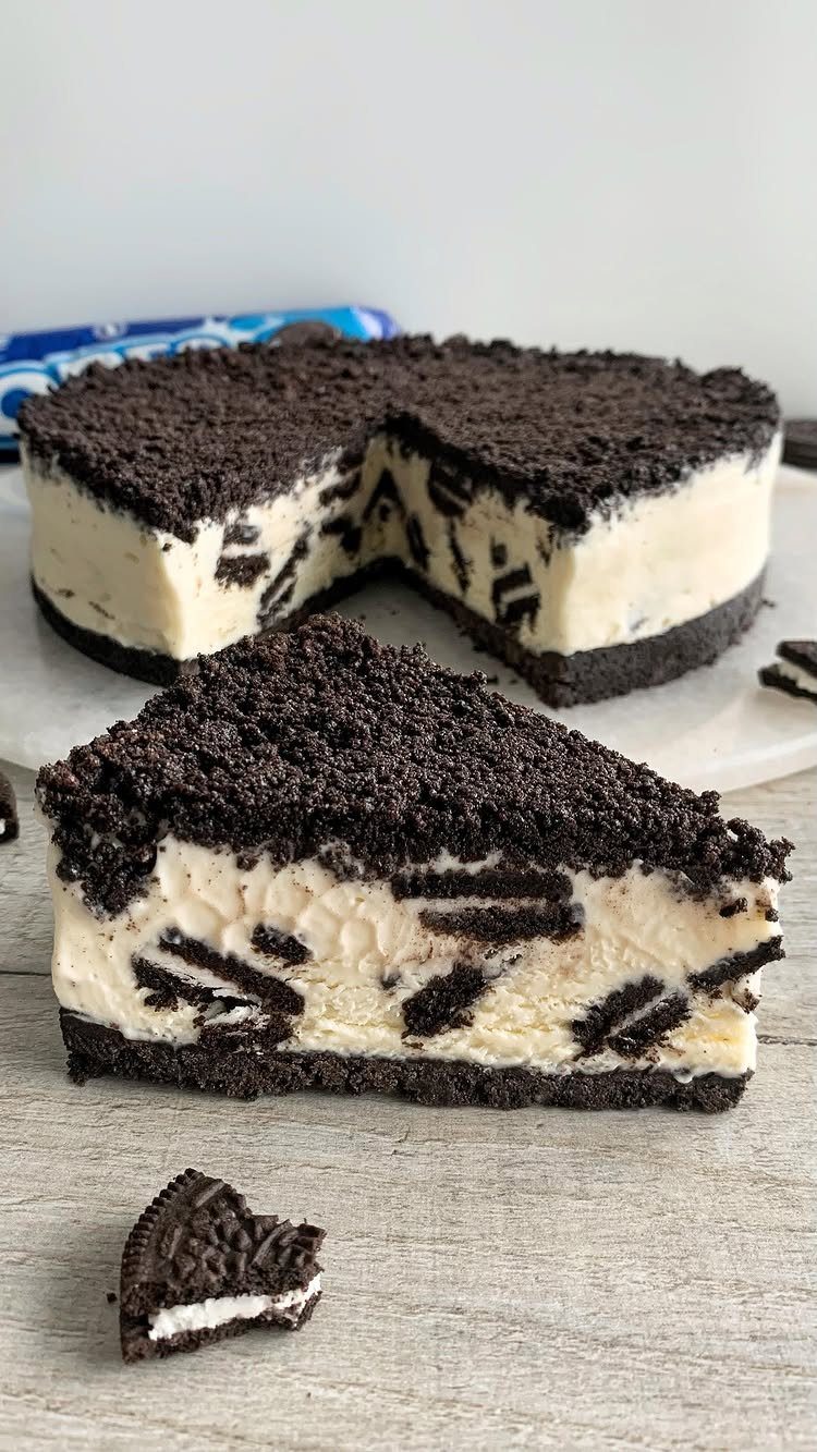 Oreo ice cream cake with cookie crust and chunks of cookies inside.