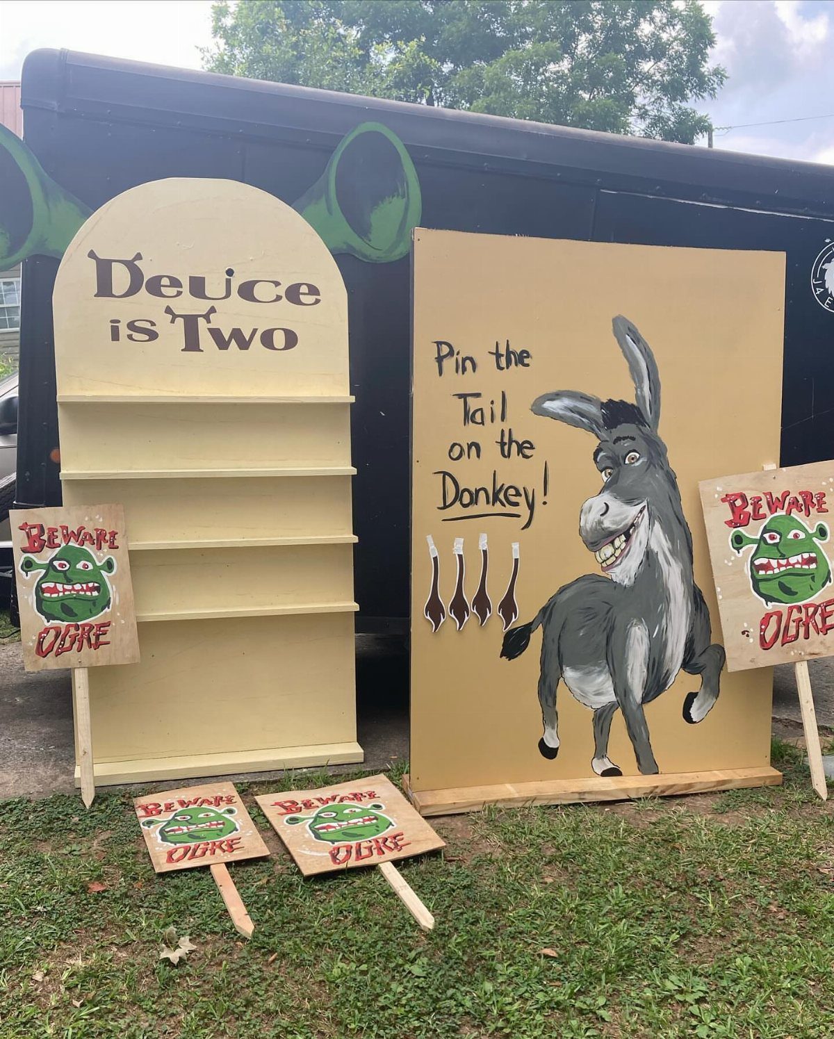 Donkey painting on a yellow board for a Pin the Tail game setup.