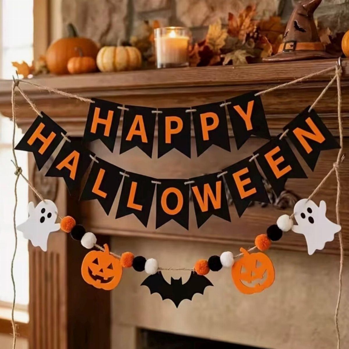 Happy Halloween banner hanging on a fireplace mantel with pumpkins and autumn decor