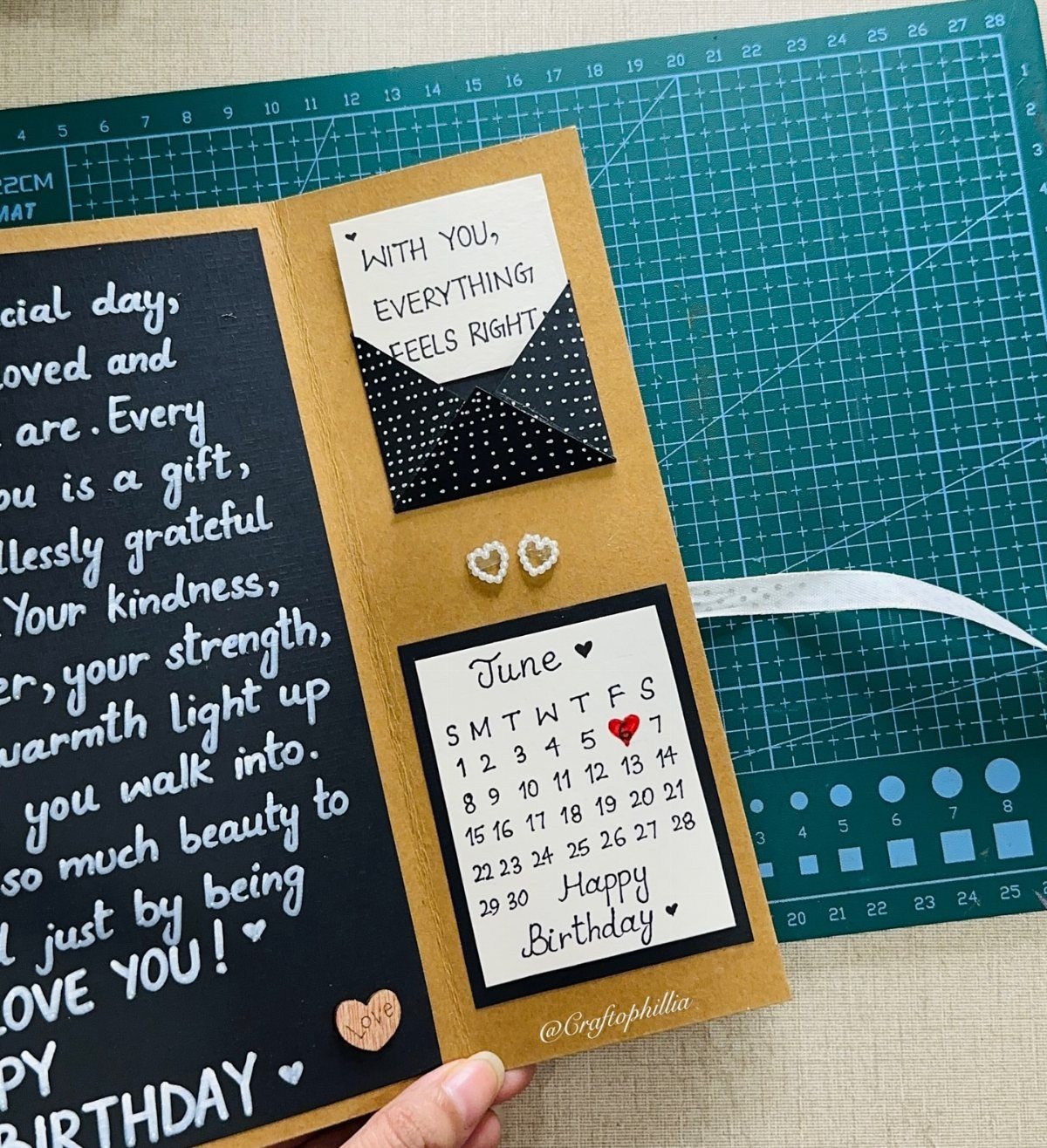 Handmade birthday card with a June calendar, small envelope, and handwritten heartfelt message.