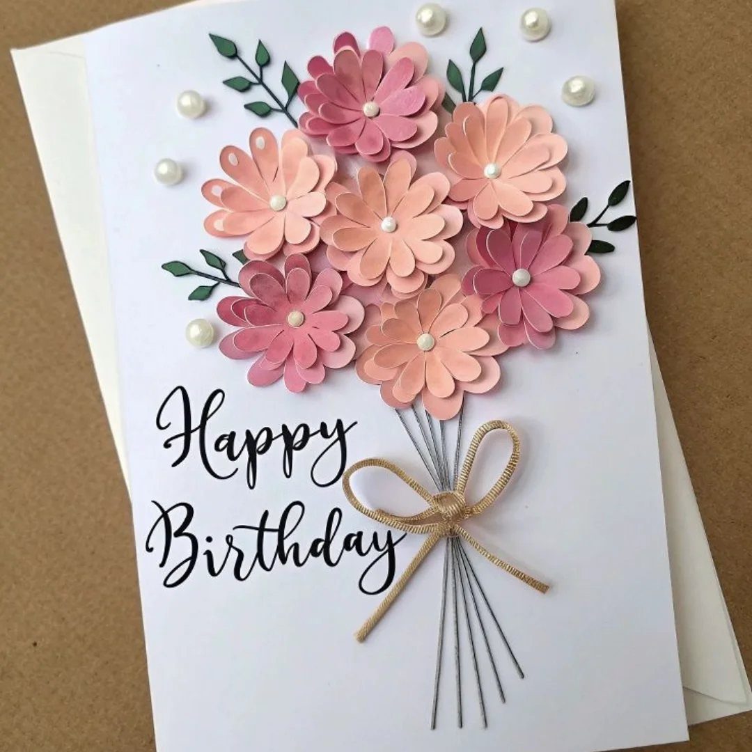 White birthday card with 3D pink paper flowers and Happy Birthday script.