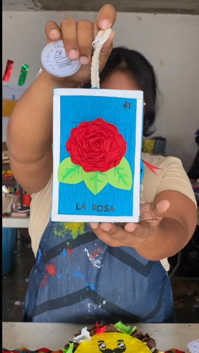 Decorative blue card with a red 3D rose and the text LA ROSA.