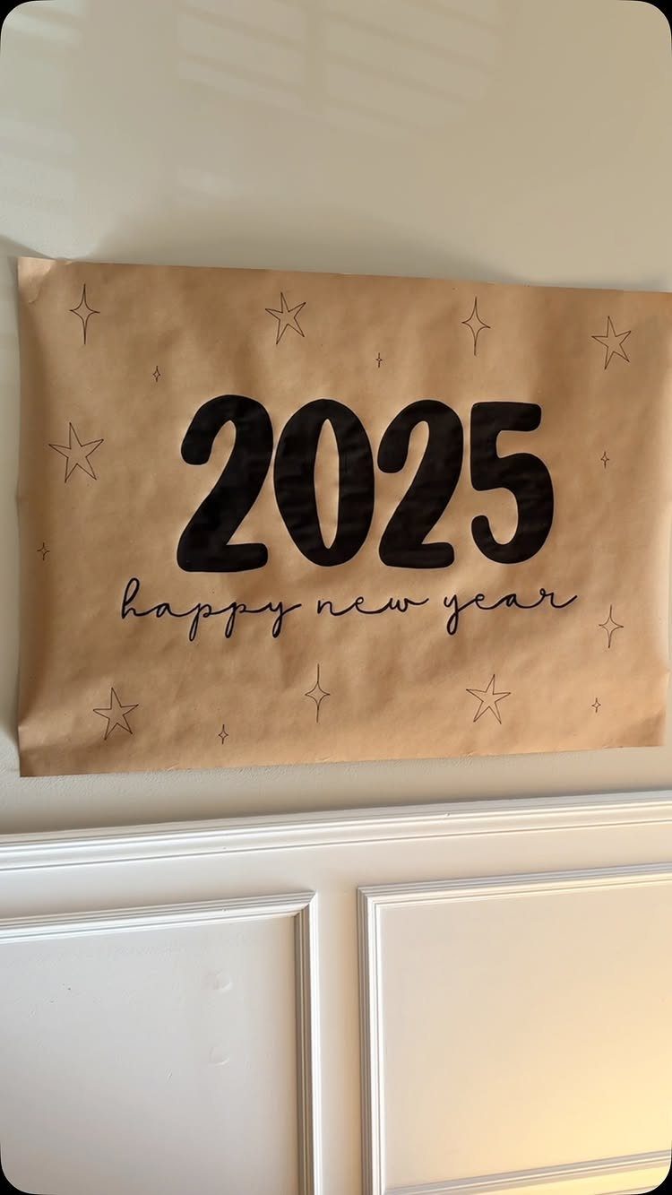 Brown paper banner with 2025 and happy new year text on white wall