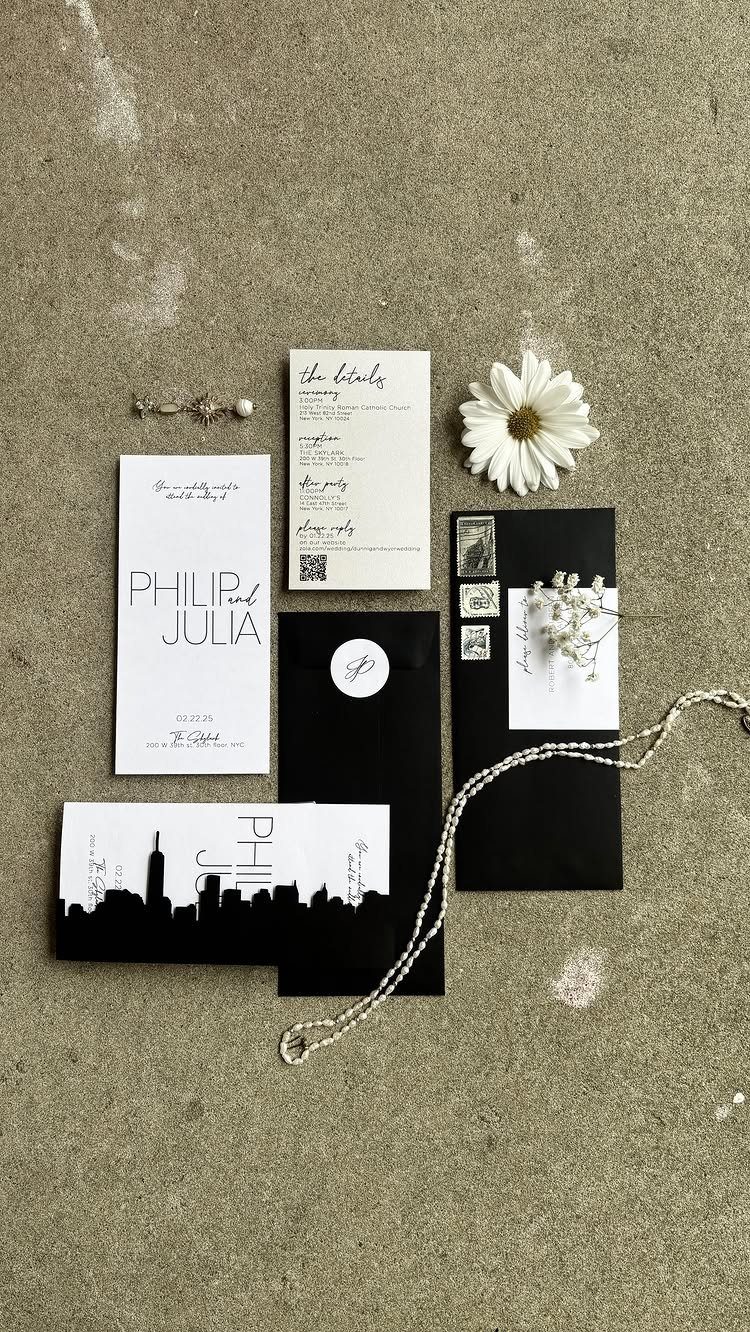 Wedding invitation suite with black envelopes and a New York City skyline silhouette.