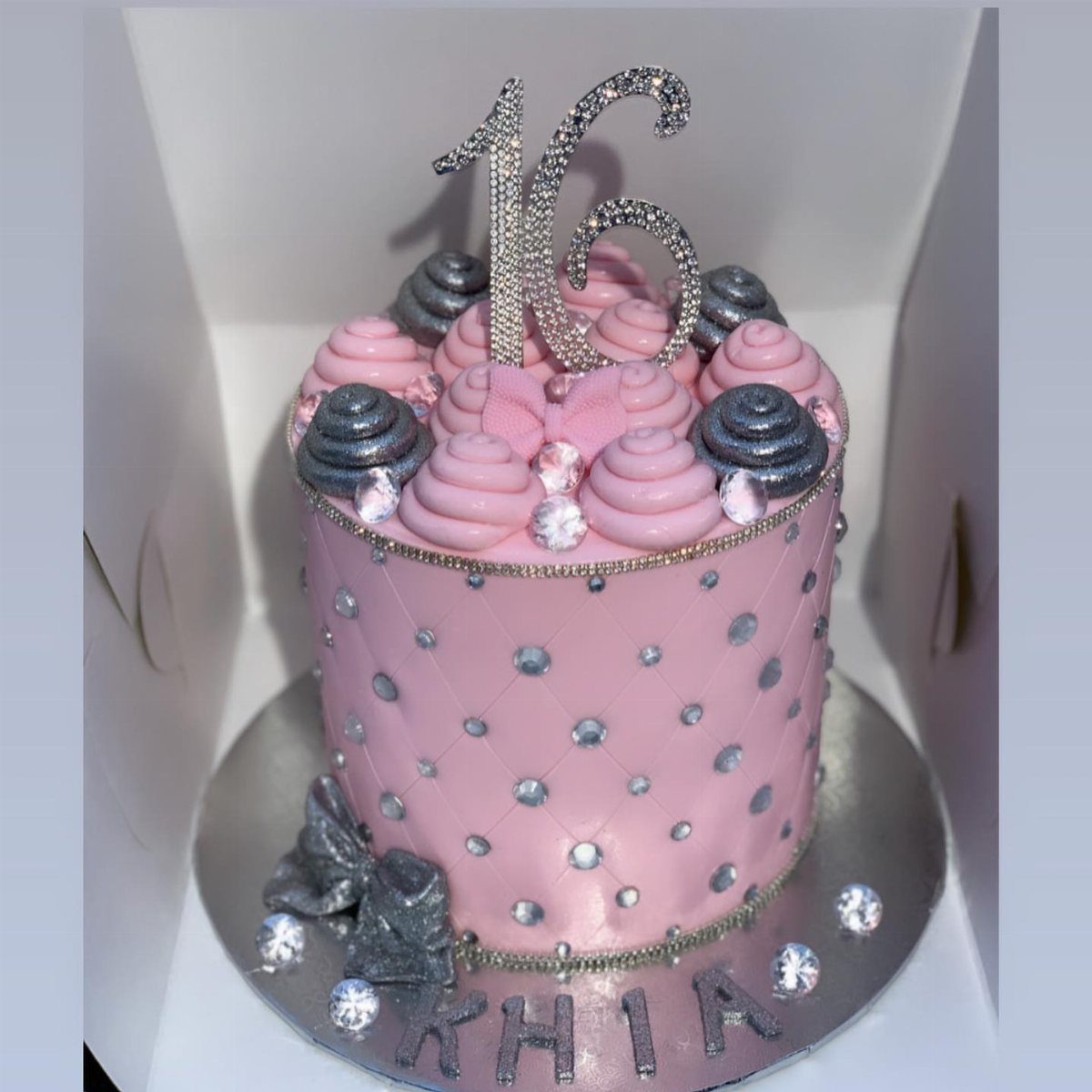 Pink quilted cake with silver rhinestones and a sparkling silver 16 topper.