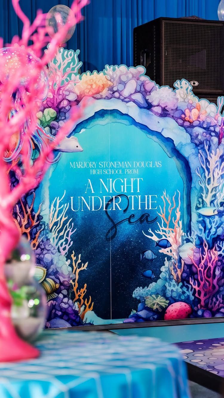 Under the sea prom backdrop with colorful coral and A Night Under the Sea text