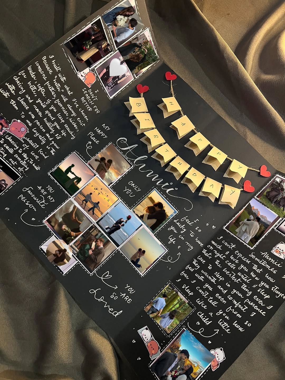 Handmade black memory card with printed couple photos, handwritten notes, and red hearts.