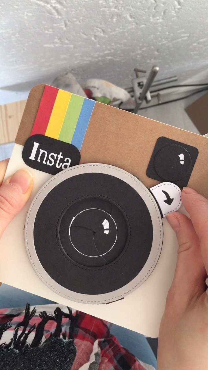 Handmade camera shaped birthday card with a rainbow stripe and black lens.