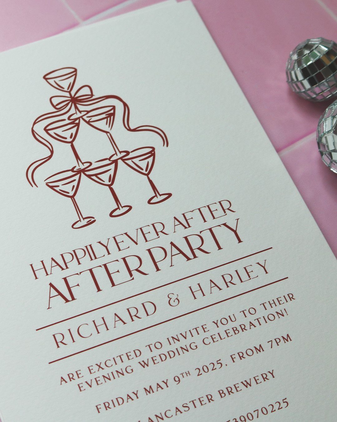 Wedding after party invitation with red text and champagne glass illustration on white card.