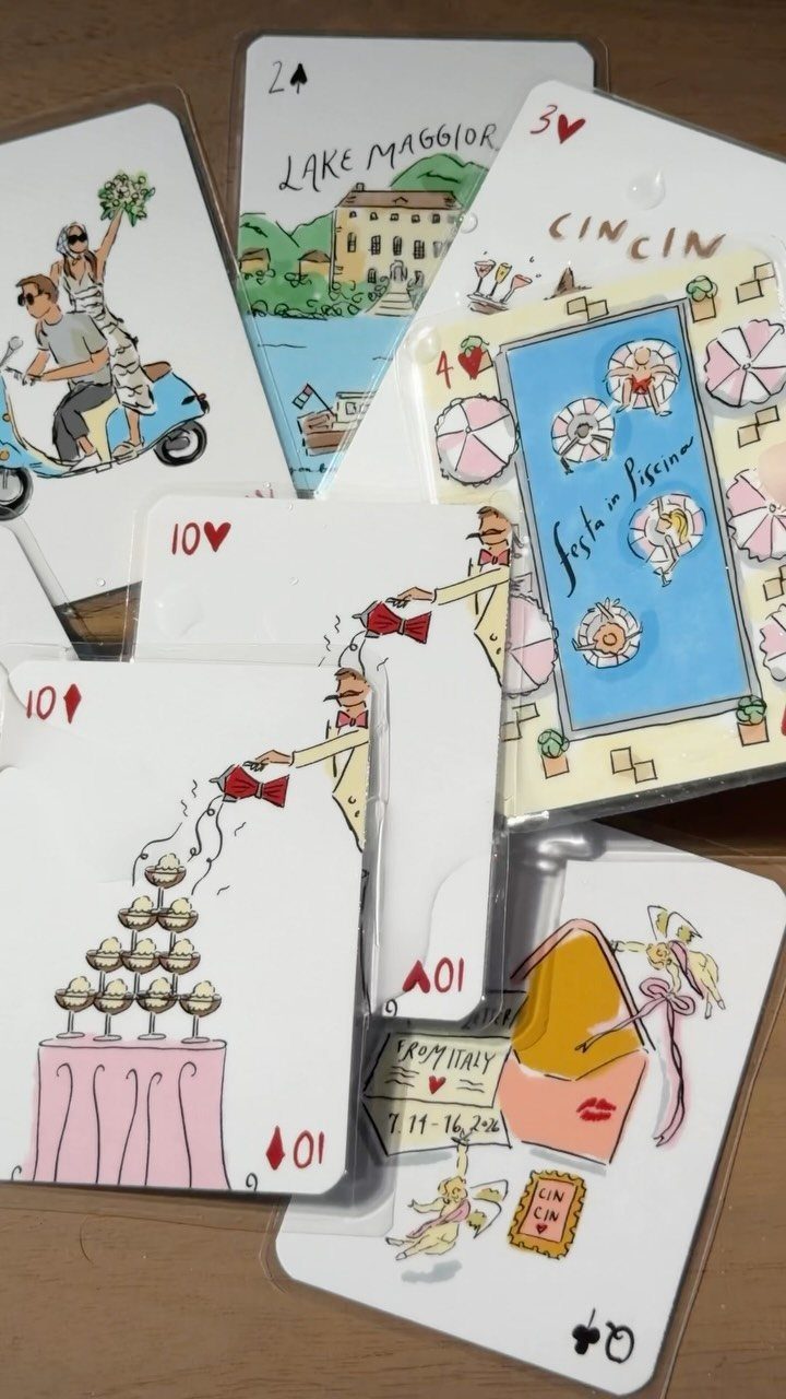 Custom playing cards with colorful illustrations of Italian scenes and wedding themes.